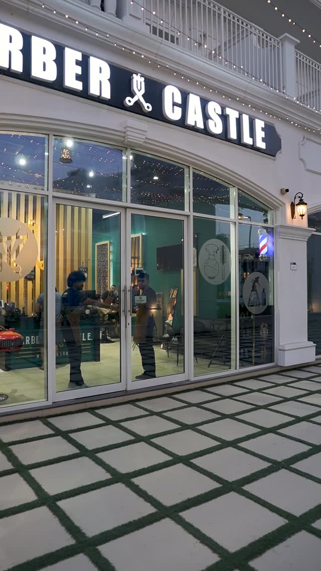 The Castle storefront in Arjan, Dubai, with the illuminated sign at night.